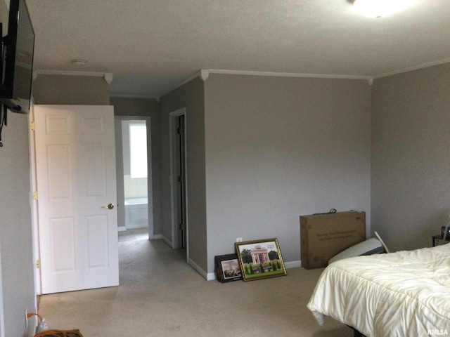 bedroom with ornamental molding and baseboards