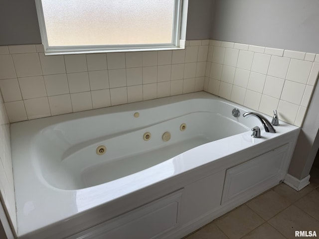 bathroom featuring a whirlpool tub and tile patterned floors