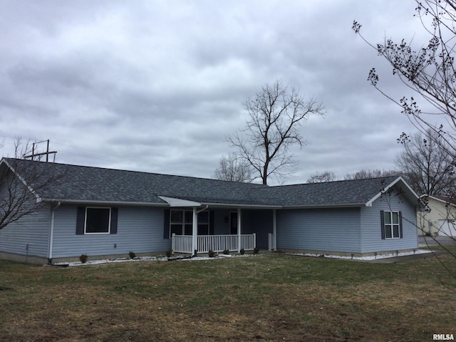 single story home with a porch, a front yard, and a shingled roof