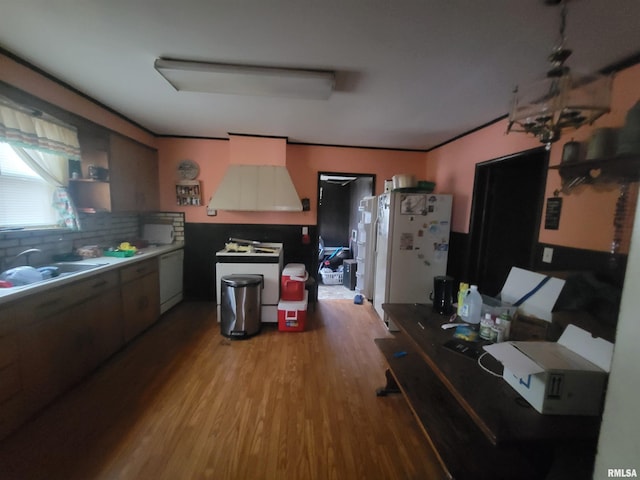 905 W Monroe St, Herrin, IL 62948 - kitchen with white appliances, a sink, decorative backsplash, and wood finished floors
