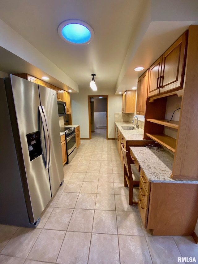 kitchen with light stone counters, light tile patterned floors, open shelves, appliances with stainless steel finishes, and a sink