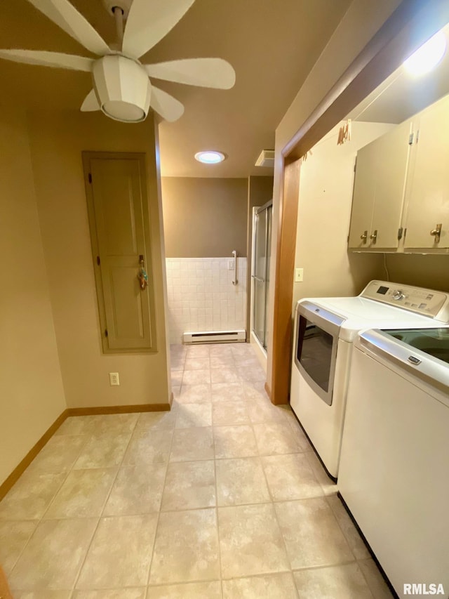 clothes washing area with laundry area, light tile patterned floors, washer and clothes dryer, ceiling fan, and baseboard heating