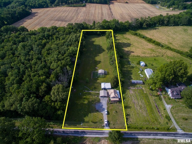 birds eye view of property with a rural view