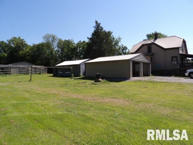 view of yard featuring an outbuilding and an outdoor structure