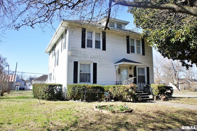 traditional style home with a front yard