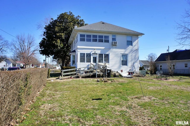 back of property featuring fence, a lawn, a chimney, and central air condition unit