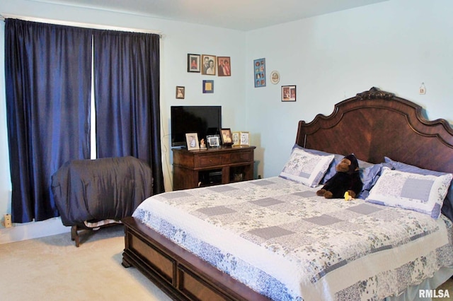 bedroom with light colored carpet