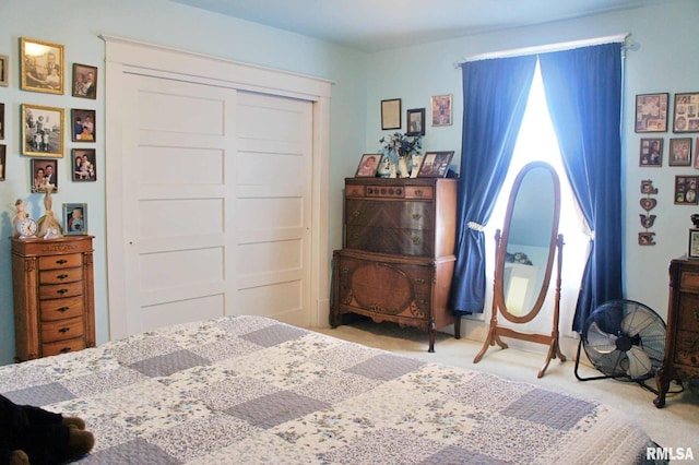 bedroom with a closet and carpet flooring