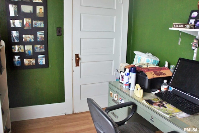 office featuring baseboards and wood finished floors