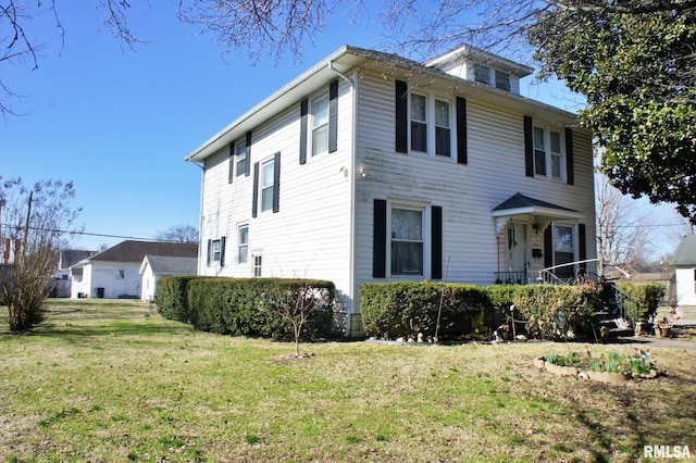 view of front of property with a front lawn