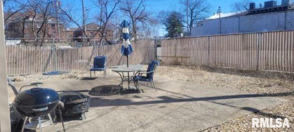 view of patio / terrace featuring a fenced backyard and a grill