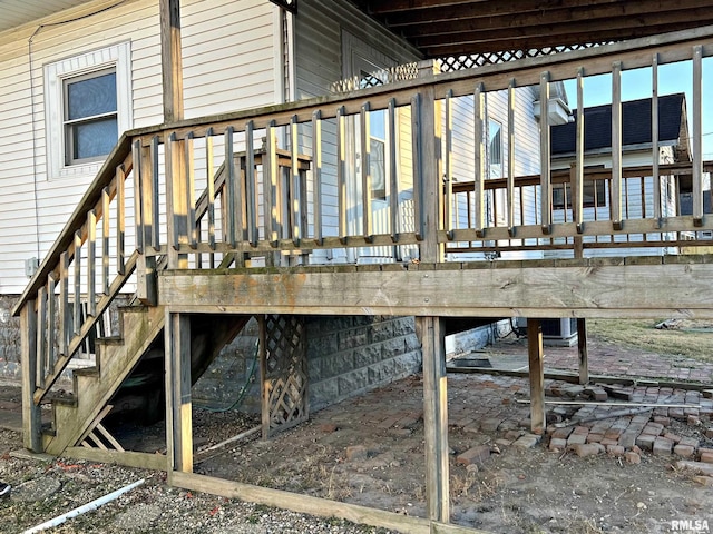 exterior space featuring central AC unit and stairs