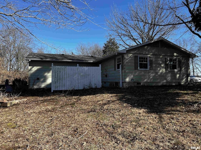 view of side of home featuring crawl space