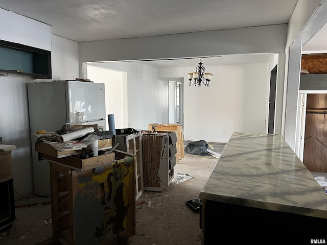 kitchen featuring a chandelier