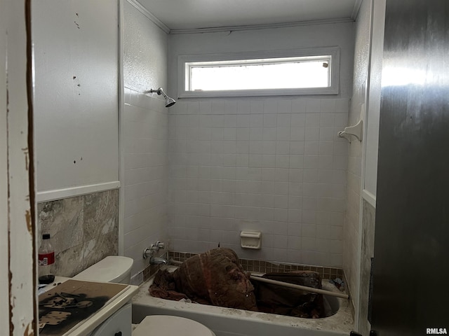 full bath featuring shower / tub combination, tile walls, and toilet