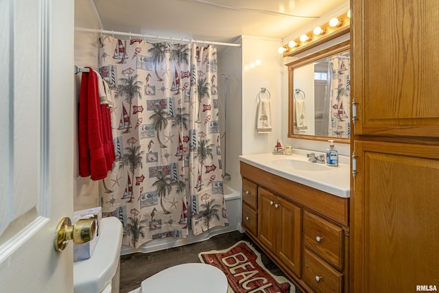 bathroom with toilet, shower / bath combo, and vanity