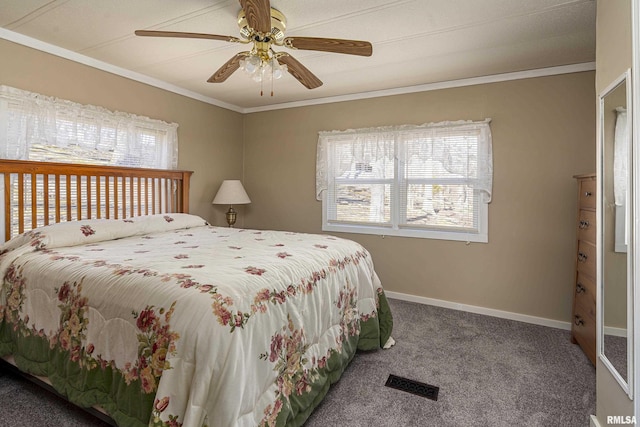 carpeted bedroom with visible vents, baseboards, ceiling fan, and crown molding