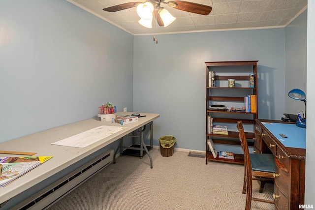 office with carpet floors, baseboards, ornamental molding, and a ceiling fan