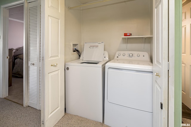 washroom with laundry area, carpet floors, and washing machine and clothes dryer