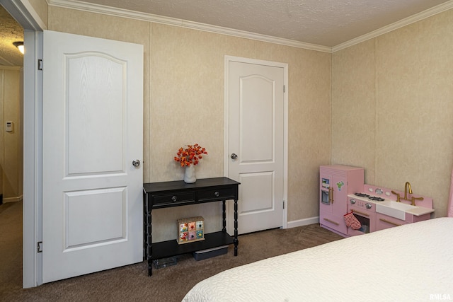 bedroom with a textured ceiling, ornamental molding, and carpet