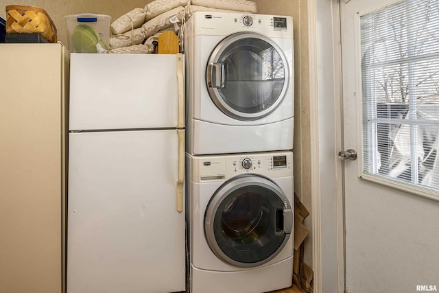 laundry room featuring laundry area and stacked washing maching and dryer