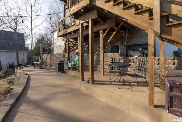 view of home's community with a patio area and outdoor dining space