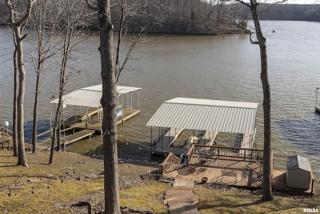 view of dock featuring a water view and boat lift