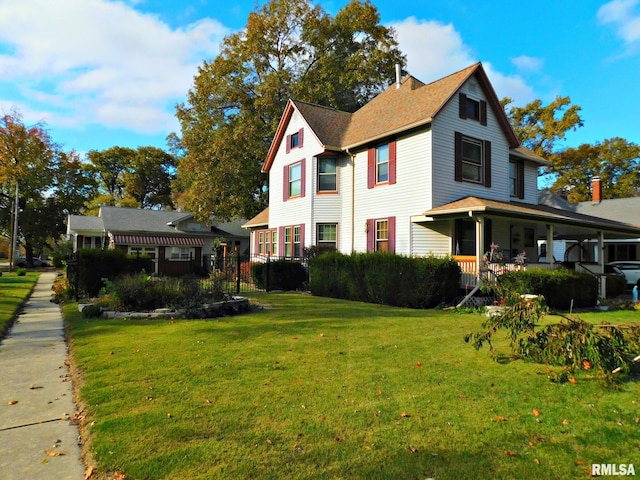 view of home's exterior featuring a porch, a yard, and a chimney