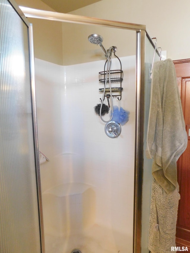 full bath featuring a shower stall