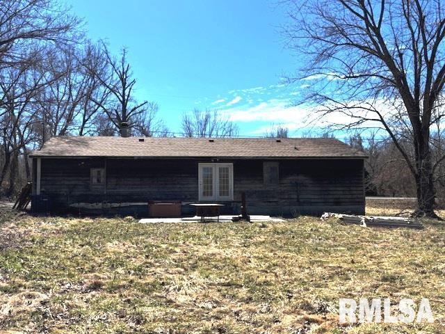 rear view of property with french doors and a patio area