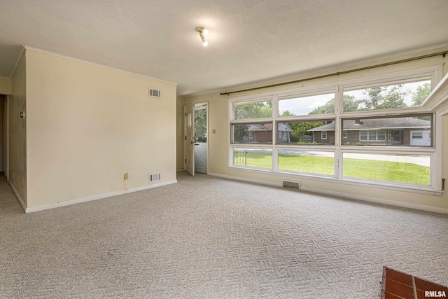 unfurnished room with light colored carpet, visible vents, and baseboards