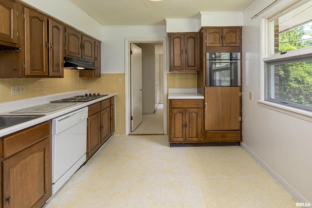 kitchen with electric cooktop, light floors, oven, white dishwasher, and under cabinet range hood