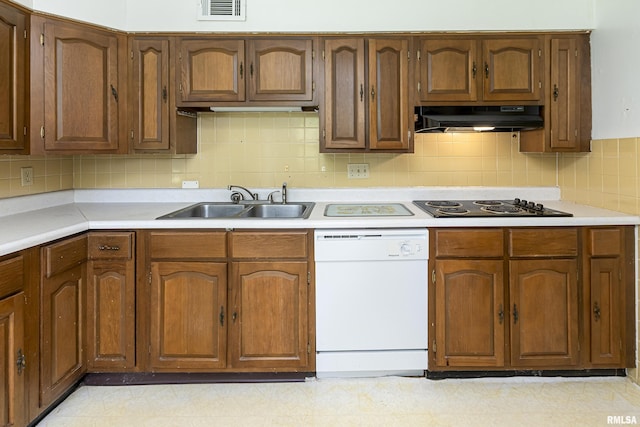 kitchen featuring visible vents, white dishwasher, black electric stovetop, light countertops, and under cabinet range hood