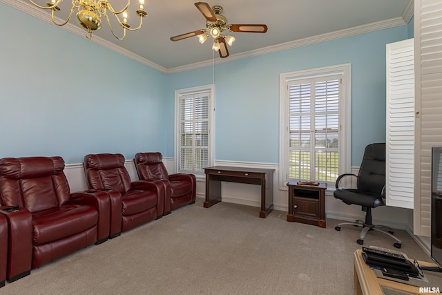 carpeted cinema room featuring baseboards, crown molding, and ceiling fan with notable chandelier