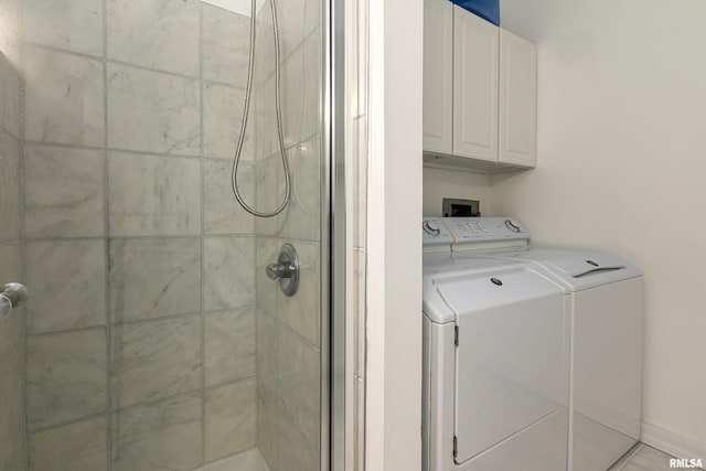 full bathroom with independent washer and dryer and a shower stall