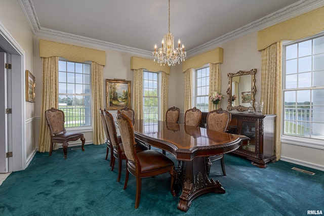 dining room with baseboards, a notable chandelier, ornamental molding, and carpet flooring