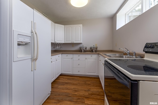 kitchen featuring range with electric cooktop, dark wood finished floors, white fridge with ice dispenser, white cabinetry, and a sink