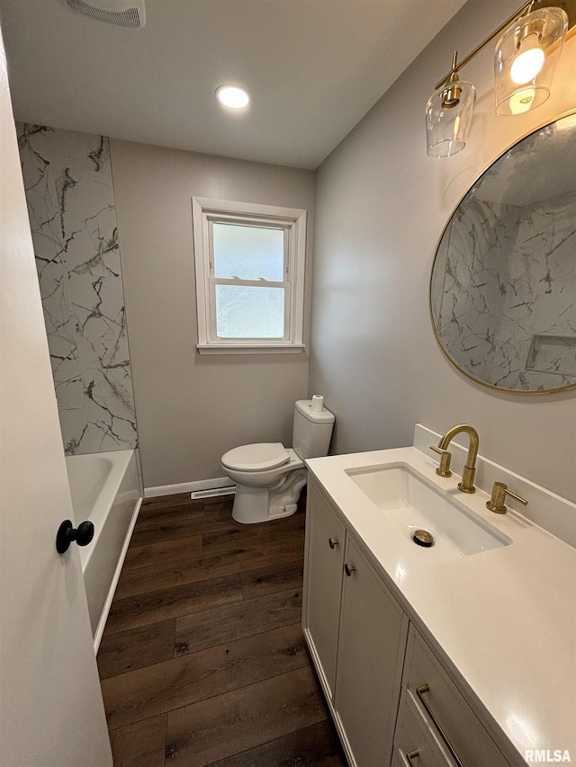 full bathroom featuring recessed lighting, visible vents, toilet, vanity, and wood finished floors