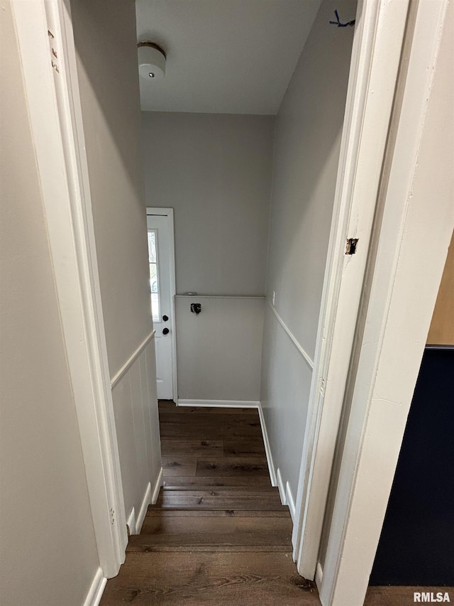 stairs featuring wood finished floors