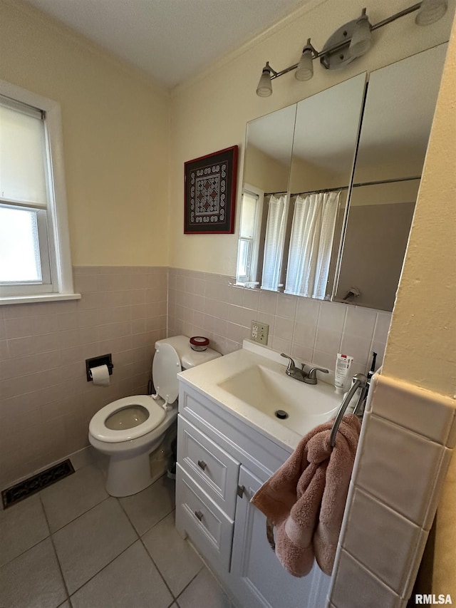 full bath featuring visible vents, toilet, tile patterned floors, crown molding, and vanity