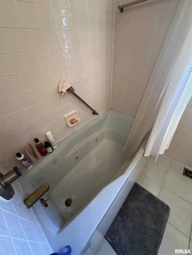 full bath featuring a combined bath / shower with jetted tub and tile patterned floors