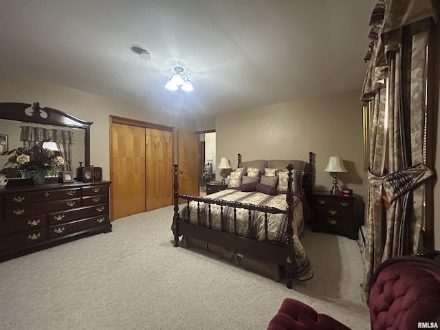 bedroom with carpet and a closet