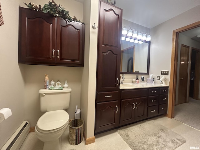 bathroom featuring a baseboard radiator, baseboards, vanity, and toilet