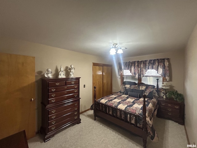 bedroom featuring a closet and light colored carpet