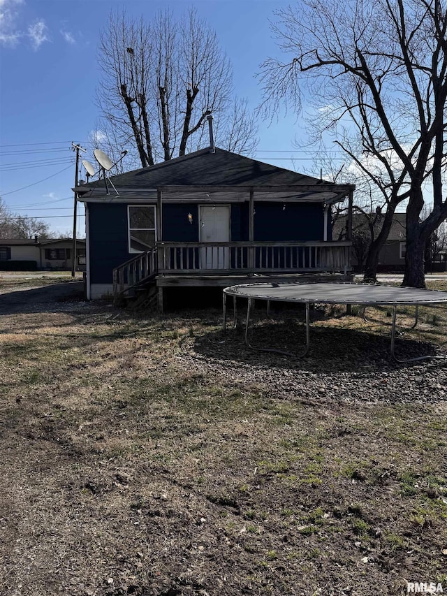 view of front of property with a trampoline