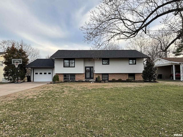 bi-level home with concrete driveway, a front lawn, an attached garage, and brick siding