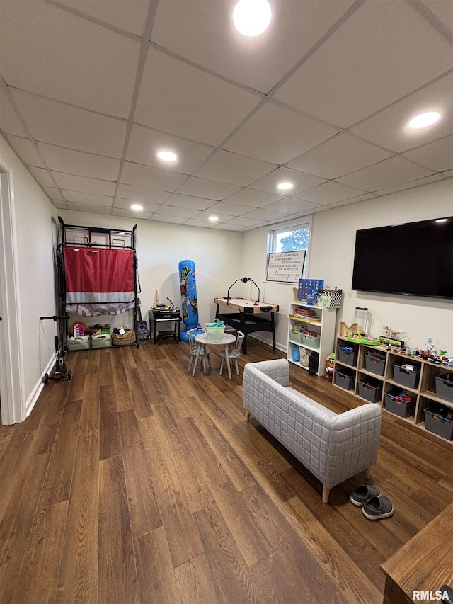 game room featuring a drop ceiling, wood finished floors, and recessed lighting