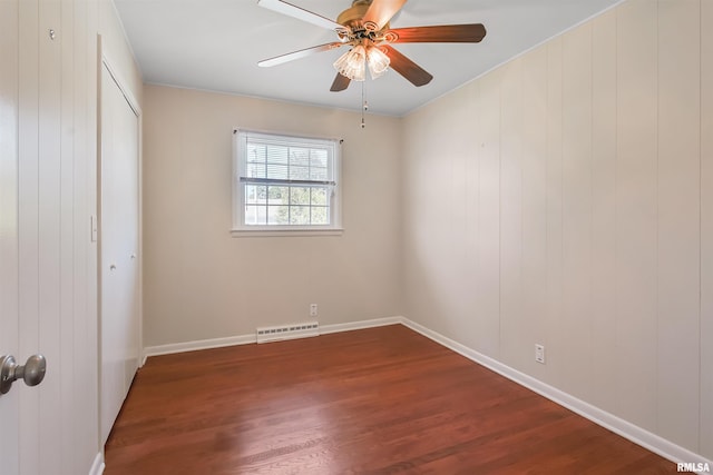 unfurnished bedroom featuring dark wood-type flooring, a closet, visible vents, and a ceiling fan