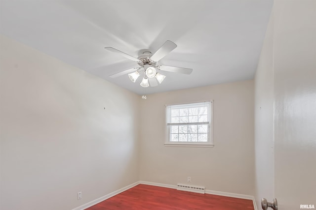 empty room featuring dark wood-type flooring, visible vents, ceiling fan, and baseboards