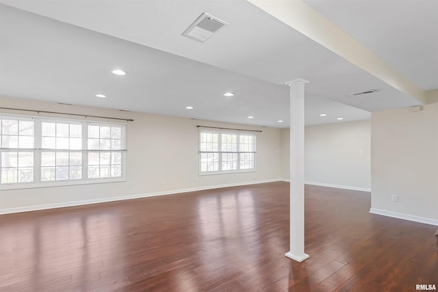 interior space featuring baseboards, visible vents, wood finished floors, ornate columns, and recessed lighting